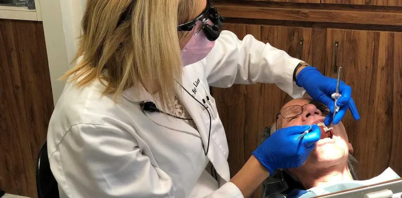 Dentist doing teeth cleaning