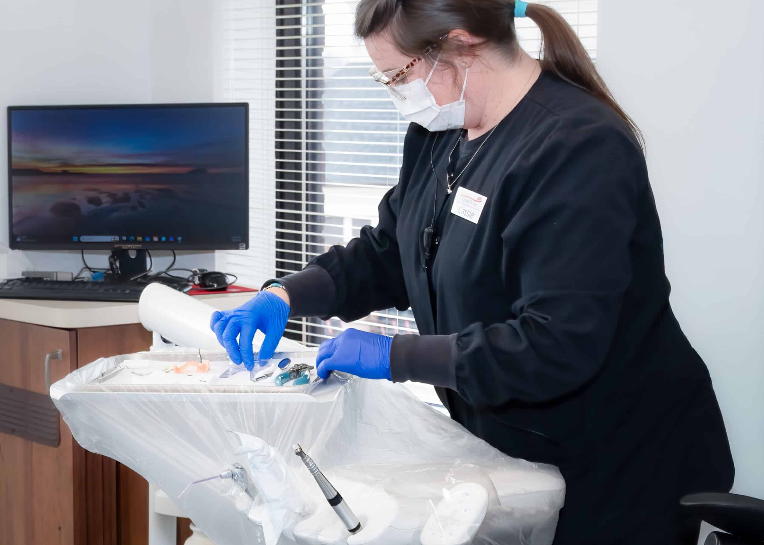Dental hygienist preparing for patient