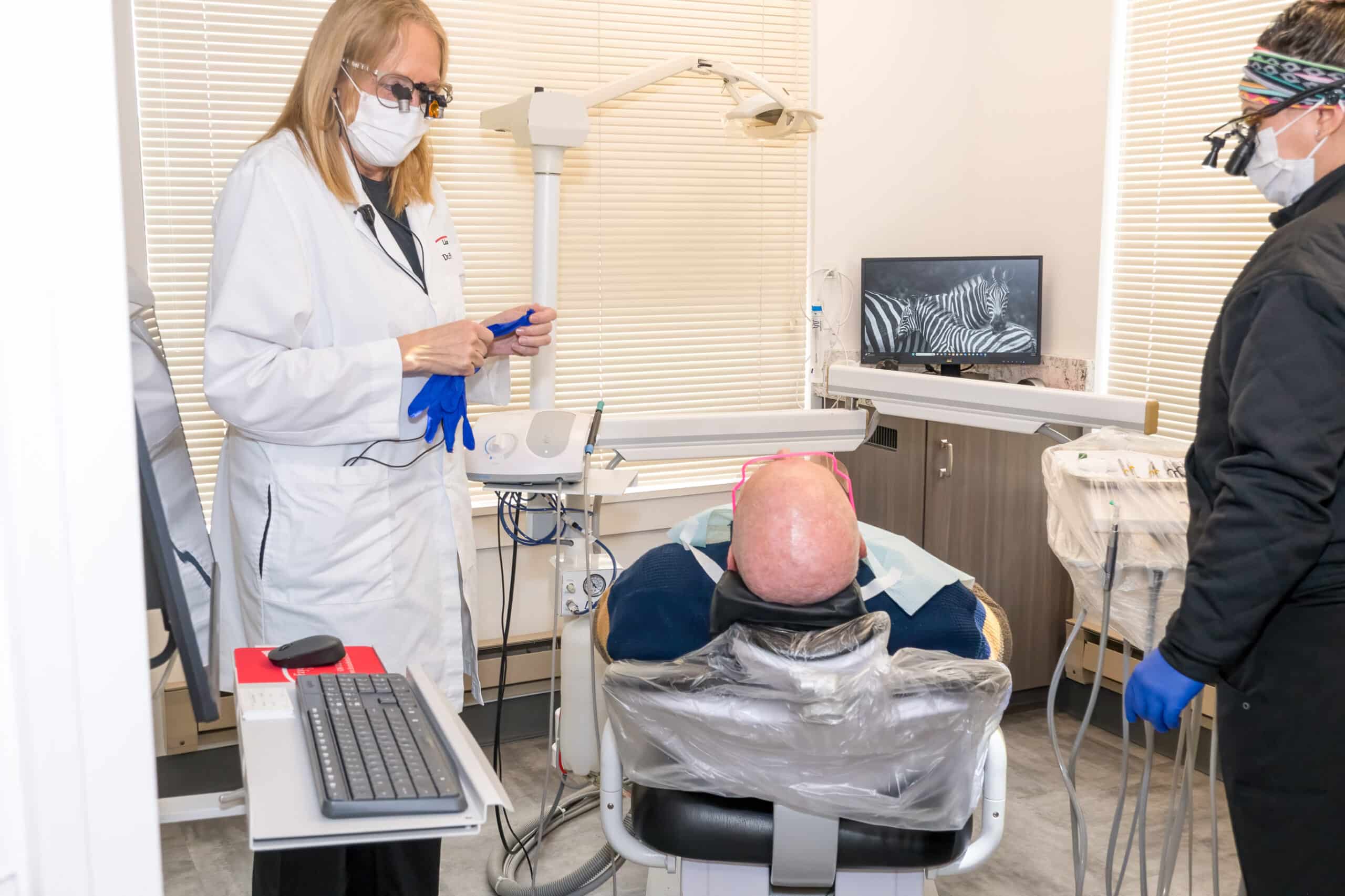 Dentist consulting with patient